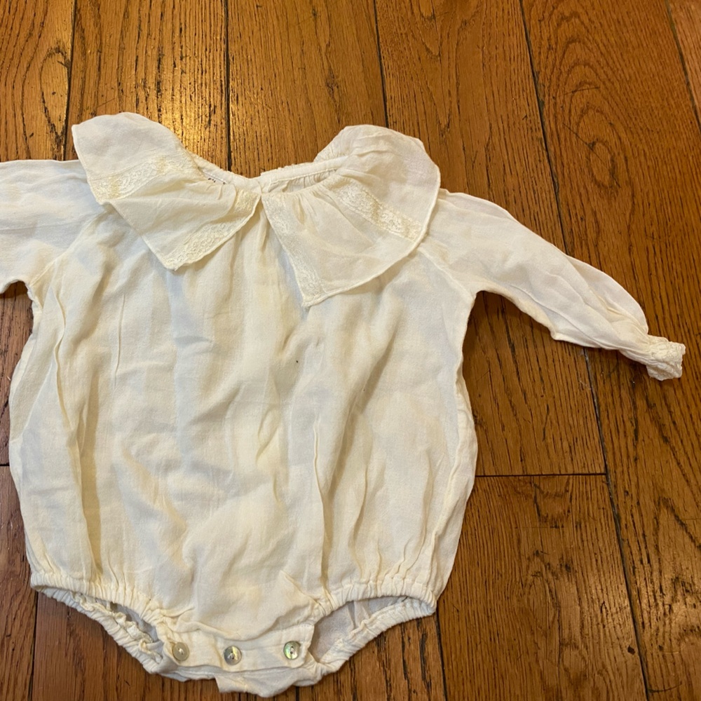 Cream body suit for baby girl